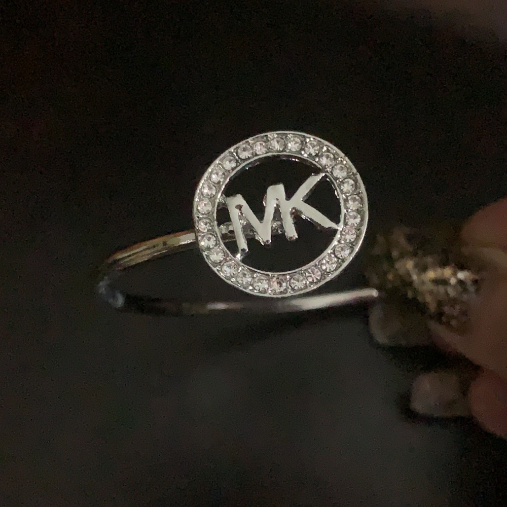 NWT silver and rhinestone designer emblem bracelet